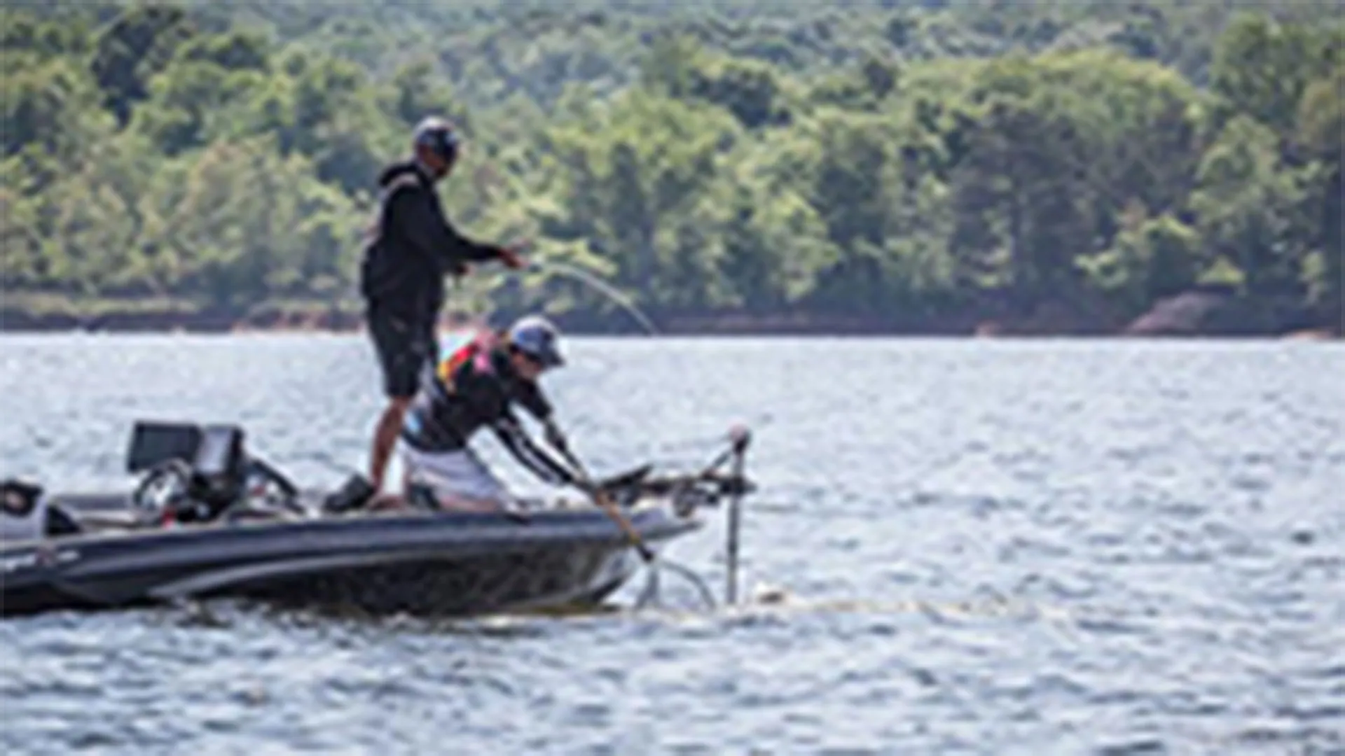 Large bass held over water